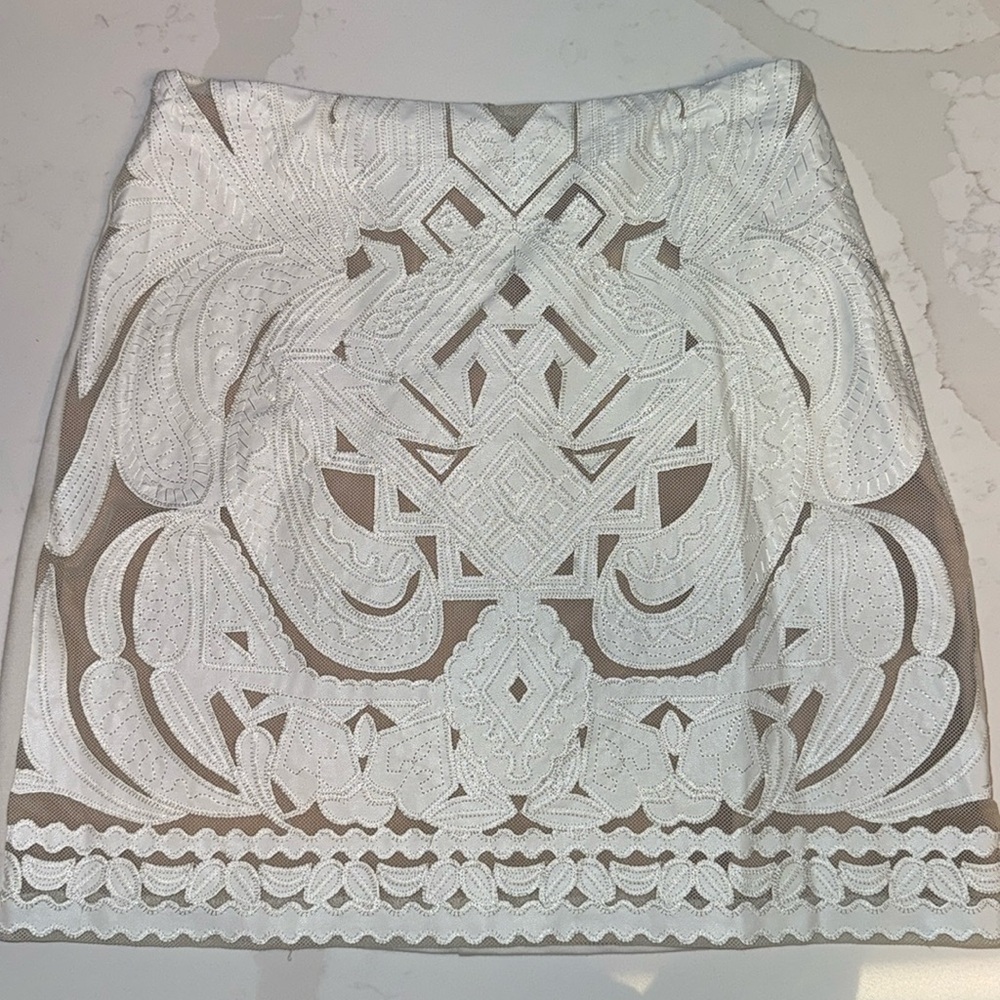 White laser cut leather/stretchy skirt